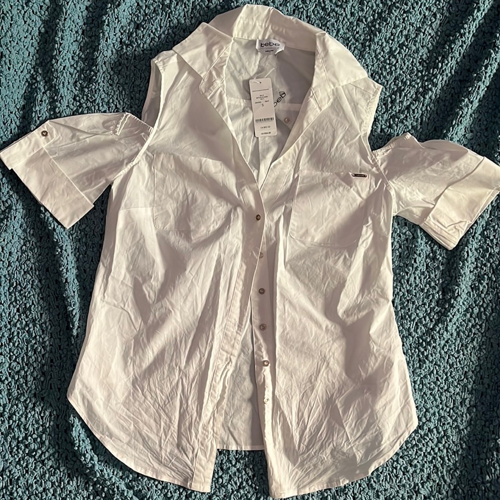Bebe size small shoulder cut out blouse.